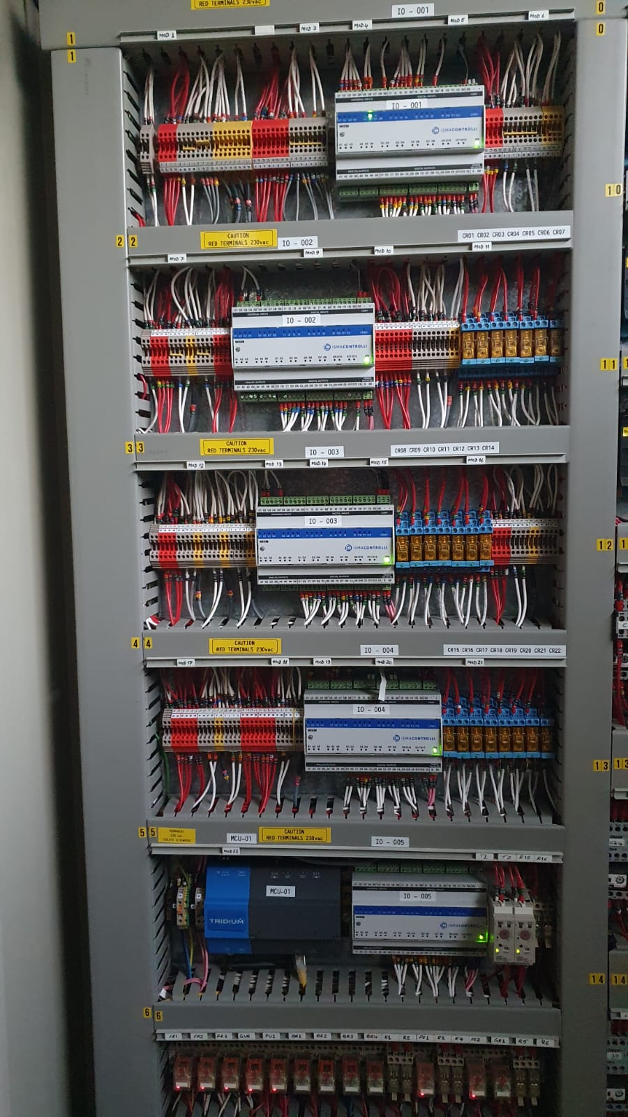 Antler controls panel with controllers, relays and labelled wiring inside an open cabinet.